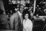 Chicago Bulls basketball star Michael Jordan posing w. ex-wife Juanita at bar at the opening of his restaurant. (Photo by Steve Kagan/Getty Images) - Source: Getty